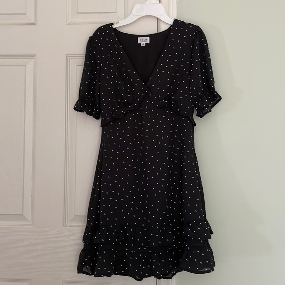 Black ruffle dress with white star print